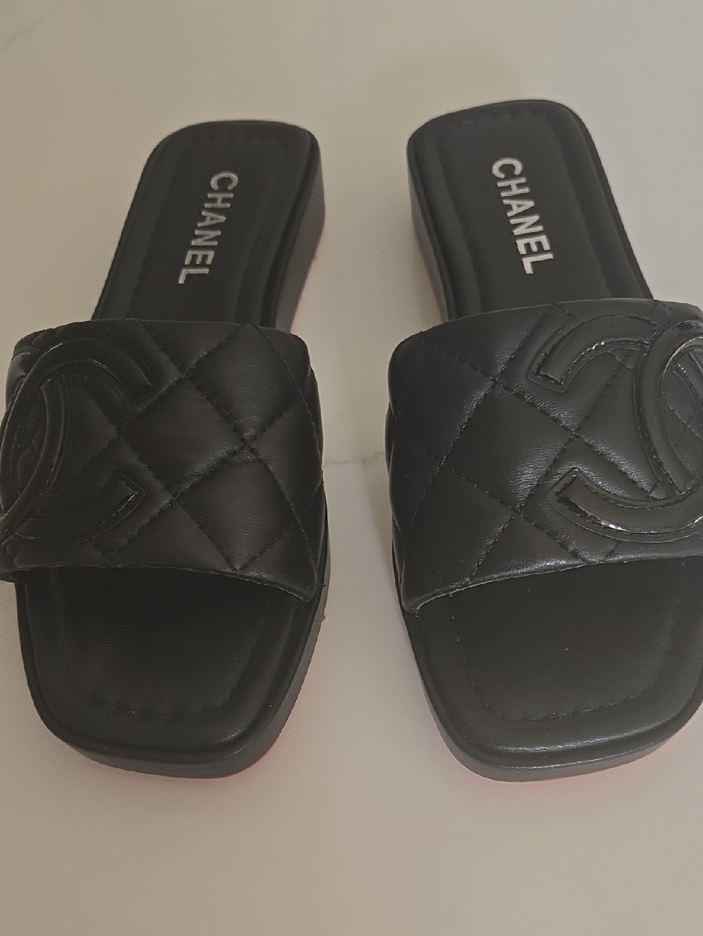 CHANEL Black Quilted Logo Slide Mules